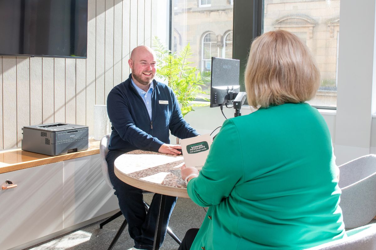 Customer with a Cumberland colleague at the English Street branch in Carlisle.